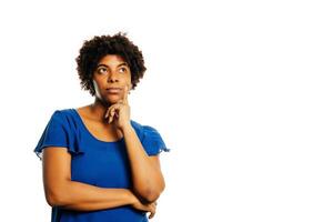 Young african american guy thinking about something over white background. photo