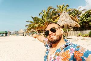 Happy tourist taking selfie in Guanaja beach Honduras. Tourism concept. photo