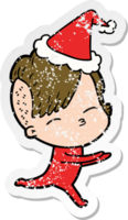 hand drawn distressed sticker cartoon of a girl in onesie wearing santa hat png