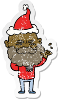 hand drawn distressed sticker cartoon of a dismissive man with beard frowning wearing santa hat png