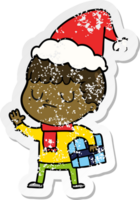 hand drawn distressed sticker cartoon of a grumpy boy wearing santa hat png