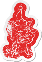 quirky cartoon distressed sticker of a dead fox wearing santa hat png