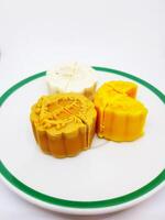 Close up sweet moon cake in plate isolated on white background with copy space. Food and dessert on dish concept photo