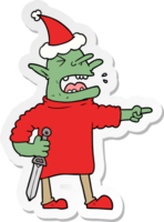 hand drawn sticker cartoon of a goblin with knife wearing santa hat png