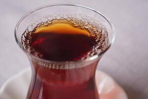 Traditional turkish tea on white table . photo