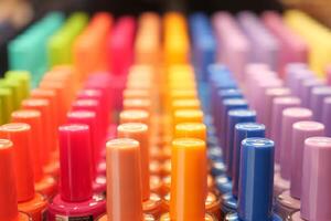 nail polish collection display at shop shelf , photo