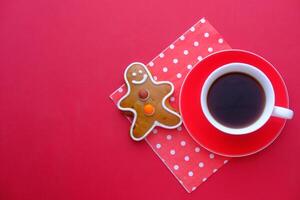 Top view of green tea and crunchy and wholemeal biscuits on red background . photo