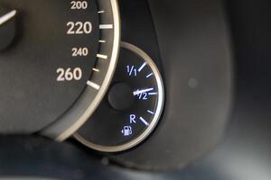 Fuel level on display. Detail from the car cockpit, a symbol of the innovation of auto industry. photo