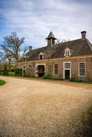 Diepenheim, Netherlands - April 7, 2024. Territory of Historic Castle Nijenhuis in city Diepenheim in Province Overijssel, Netherlands. High quality photo