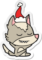 amichevole mano disegnato etichetta cartone animato di un' lupo seduta indossare Santa cappello png