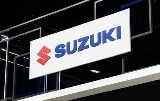 Nonthaburi Thailand 6 March 2024 billboard with logo Suzuki on wall at Bangkok International Motor Show 2024 photo