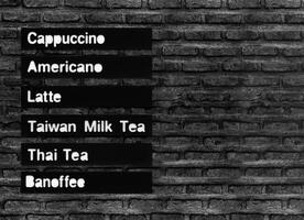 Menu coffee and more on black brick wall photo