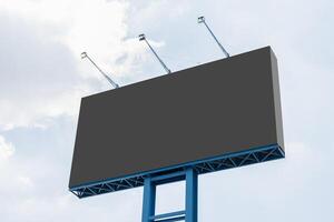 Outdoor pole billboard with blue sky background photo