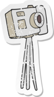 retro distressed sticker of a cartoon camera on tripod png