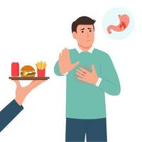 Man suffering from heartburn after fast food.Guy showing stop hand sign for unhealthy,fat, high-calorie meals. Dieting and healthy lifestyle. vector