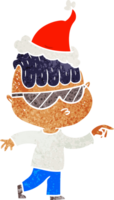 mão desenhado retro desenho animado do uma Garoto vestindo oculos de sol apontando vestindo santa chapéu png