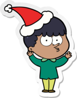 mano dibujado pegatina dibujos animados de un curioso chico vistiendo Papa Noel sombrero png