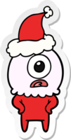 hand drawn sticker cartoon of a cyclops alien spaceman wearing santa hat png