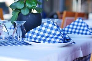 served and decorated round festive table in a restaurant photo