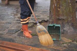 cleaning the fallen leaves in the park photo