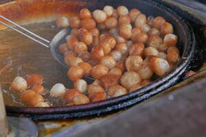 Traditional fried sweets lokma in sugar syrup photo