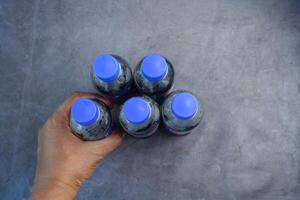 plastic bottles of soft drink on table photo