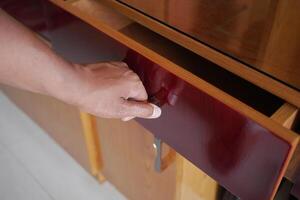 top view of men hand open a a drawer photo