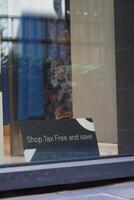 shop tax free text duty free shop sign on shop window photo