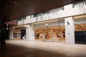 Turkey istanbul 18 july 2023., Zara store front featuring a metal sign in a modern font on a glass facade photo