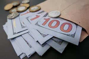 Close up of 100 dollar cash in envelope. photo