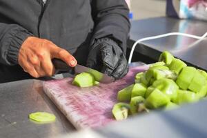 cutting Ripe kiwi fruit on a chopping board photo