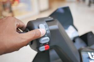 Man hand holding handlebar and pressing the Start, photo