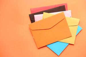 high angle view of colorful envelopes on white background photo