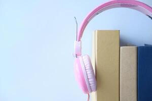 book and headphone on white background. close up photo