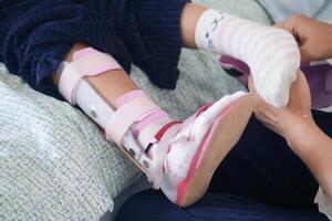 Child cerebral palsy disability, legs orthosis. photo