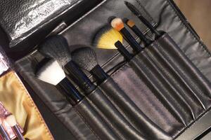 Set of makeup brushes in a sleek black case for flawless application photo