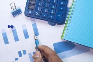 businessman analyzing working on office desk, top view photo