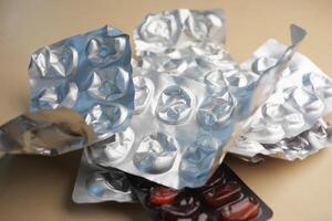 Close up of empty pills of blister pack on table photo