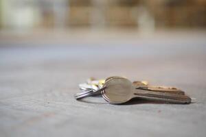 house keys on the ring on table in a room. To forget keys at home concept , photo