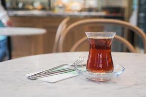 Traditional turkish tea on white table . photo