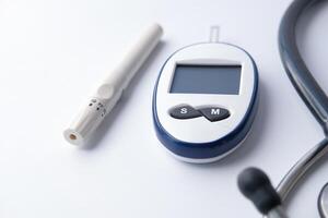 Close up of diabetic measurement tools and pills on color background photo