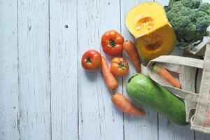 fresh vegetables and shopping bag with copy space photo