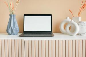 laptop with blank screen on office desk. photo