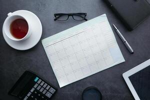 high angle view of weekly planner on table. photo