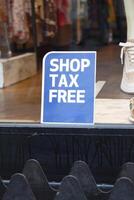 shop tax free text duty free shop sign on shop window photo