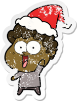 hand- getrokken verontrust sticker tekenfilm van een gelukkig Mens vervelend de kerstman hoed png