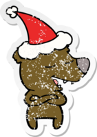 hand drawn distressed sticker cartoon of a bear wearing santa hat png