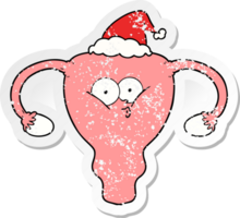 hand drawn distressed sticker cartoon of a uterus wearing santa hat png