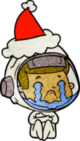 main tiré texturé dessin animé de une pleurs astronaute portant Père Noël chapeau png