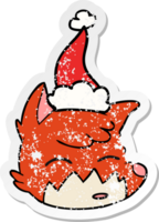 hand drawn distressed sticker cartoon of a fox face wearing santa hat png